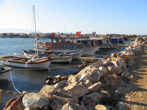 boats tied to rocks